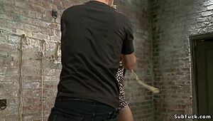 Brunette Slave Gagged with Dildo in Kinky Bondage Setup