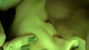 laying down licking balls, close-up style