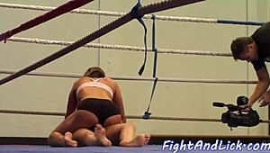 athletic babe wrestling with another in a match