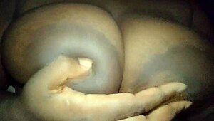 ebony babe can't resist groping her big, horny breasts. she teases herself wild in a steamy moment.