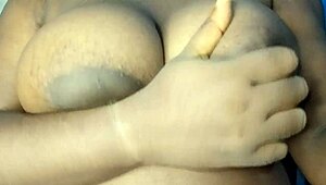 ebony babe can't resist groping her big, horny breasts. she teases herself wild in a steamy moment.