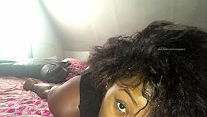 Slim black woman in thong teases and exposes her asshole on bed