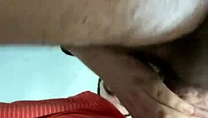 Rear view of gay deepthroat gagging and choking on hairy cock.