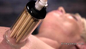 Blonde cougar bound tight and clamped for wild play