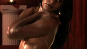 Her bronze skin shines while teasing nude