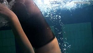 Lozhkova lounges in see-through shorts by the pool