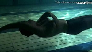 Lozhkova lounges in see-through shorts by the pool