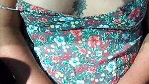 Latina with tattoos flaunts her body in a moving car