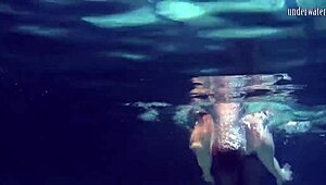 Lozhkova lounges in see-through shorts by the pool