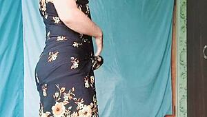 A gay blonde in a MILF dress rides a cowgirl style in this amateur crossdressing video