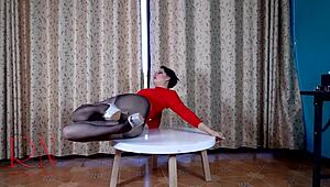 Nice lady in pantyhose heels teasing striptease round table