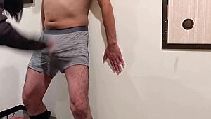 Femdom bitch laughs while kicking and slapping m-man's cock.