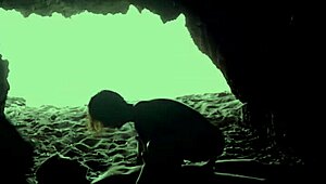 A couple's intimate encounter in a secluded beach cave