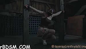 A tight and clamped girlfriend receives a hook in her anus for punishment