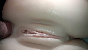 Sexual close-up of penis sliding into snow-white tight ass