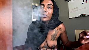 Sensual hijabi woman indulges in nipple clamps and smoking