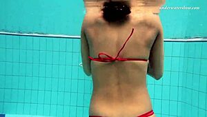 Brunette and tight Russian lesbians in pool
