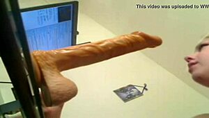 blonde deep throats huge dildo, wanna see her cum?