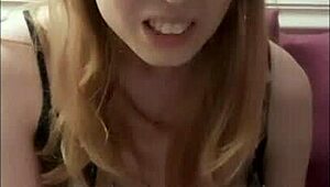 Cute tranny awkwardly giggles while stroking her thick cock