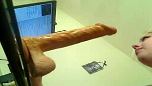 blonde deep throats huge dildo, wanna see her cum?