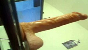 blonde deep throats huge dildo, wanna see her cum?