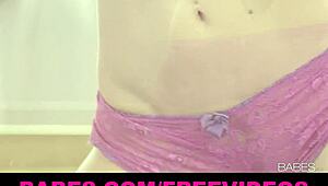 busty blonde stripteases, ripping clothes to show wet dripping tits.