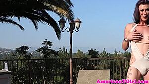 busty transwoman jerks cock outdoors in bikini