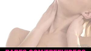 busty blonde stripteases, ripping clothes to show wet dripping tits.