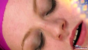 Short-haired cute redhead licks lolipop before sucking