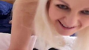 Petite blonde woman enjoys a solo ride on a large dildo.