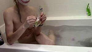 i watch this cute skinny blonde take a bath naked with panties on christmas with a clown