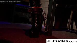 bound hottie fingers her pussy while chained up nude