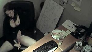 Horny secretary rubs big tits while masturbating in office hidden cam.