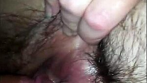 he loves teasing her hairy pussy in close-up homemade video