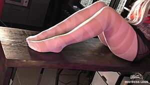 Goddess in white pantyhose teasing nylon toes on desk