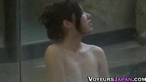 Naked Asian teens shower while unaware of spying eyes in public bathhouse setting