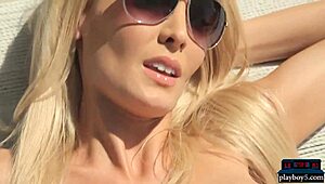 Blonde MILF's intriguing photoshoot striptease.