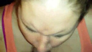 Wife boldly swallows black cock in interracial session.