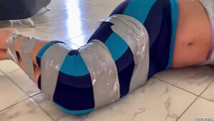ball gagged girl struggles hard in barefoot tape bondage challenge