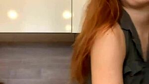 Young russian redheaded bitch moves sexually in front of the camera