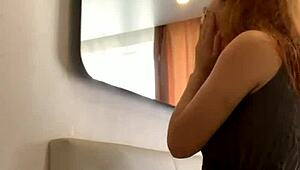 Young russian redheaded bitch moves sexually in front of the camera