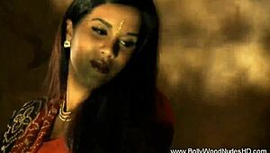 brunette indian performs teasing striptease with undressing and dancing