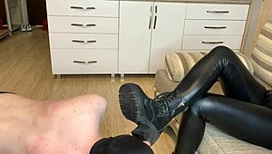Slave licks dirty soles of mistress's boots