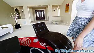 Busty babe strokes cock with oiled big tits in close-up view