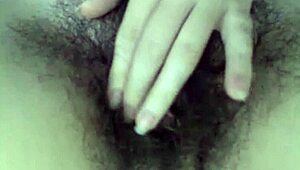 This hairy teen performs on webcam with her natural body.