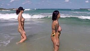 woman with big tits on the sand beach