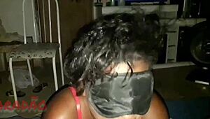 Busty black woman gives blowjob to big black cock in blowbang