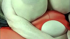 Lady with huge tits lies back enjoying a massive BBC toy session