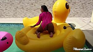Maxine X teases by the pool, shoving a huge dildo into her squirting slit. What a wild solo show!