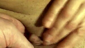 milf reaches orgasm with fingering and clit rubbing techniques.